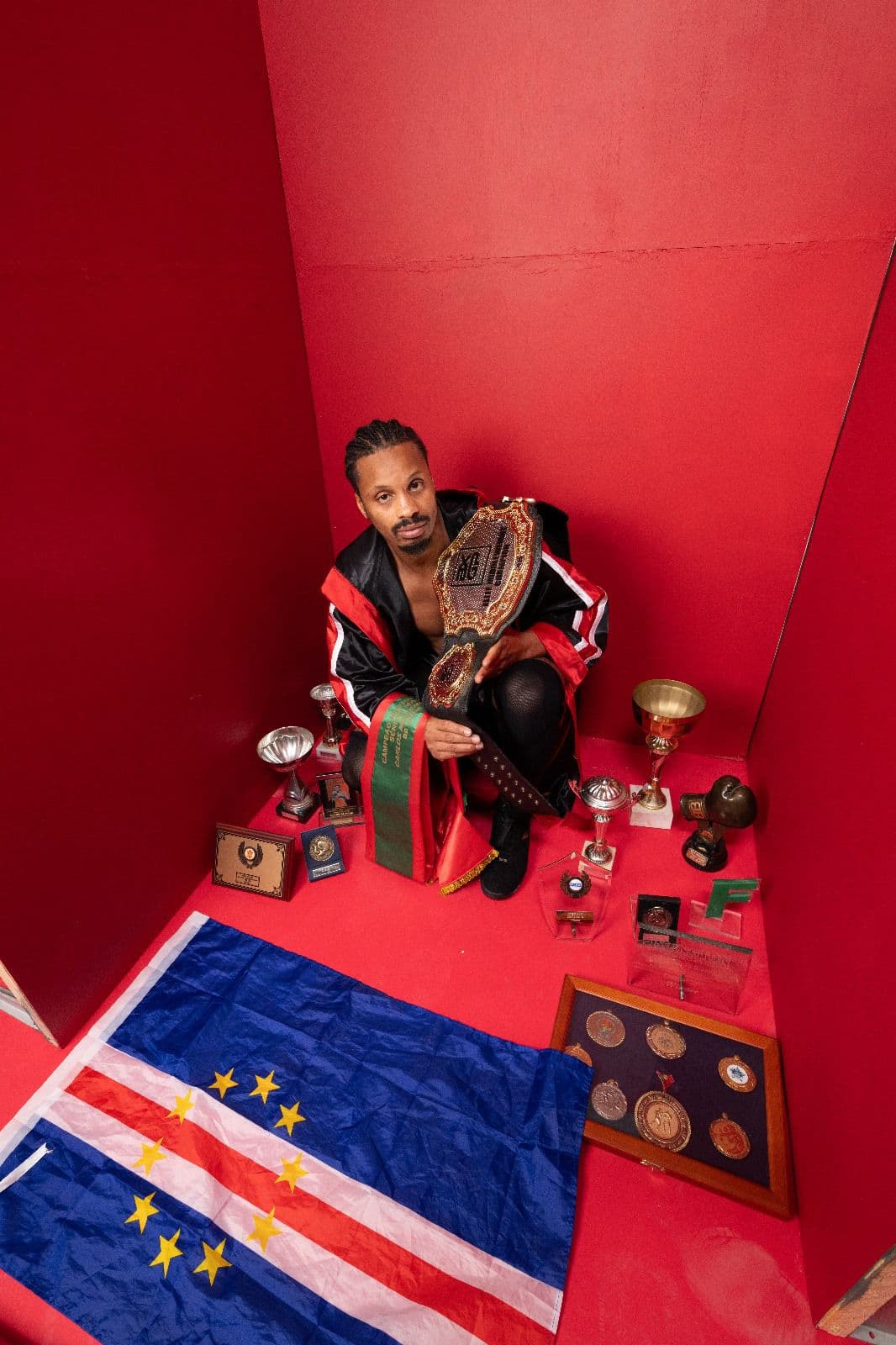 Carlos Moreno with the Cape Verde flag and boxing achievements